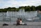 People relax in the summer at the light-music fountain in the Moscow Tsaritsyno Park