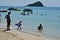 People relaxing on the beach.Tourists come and play the sea.