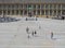 People relaxing and enjoying the summer sunshine in cafes and on the steps in the square of halifax piece hall in west yorkshire