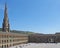 People relaxing and enjoying the summer sunshine in the square of halifax piece hall in west yorkshire