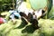 People relaxing with hiker\'s shoes in tent