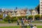 People relaxing in park in front of the Painted Ladies Houses in San Francisco USA