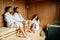 People relaxing in sauna