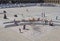 People relaxing on the steps and enjoying the summer sunshine in the square of halifax piece hall in west yorkshire