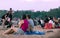 People relaxing on a Sunday evening at the beach. Pink look at sunset. Scene in front of Mindil markets, Darwin, Northern