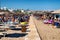 People relaxing under sunshades at resort Faliraki in Rhodes island, Greece