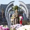 People remembering their loved ones who died; on the cemetery