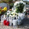 People remembering their loved ones who died; on the cemetery