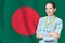 People Republic of Bangladesh healthcare concept with doctor on flag background. Medical insurance, work or study in the country