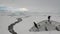 People on research expedition vessel in ice icebergs of Antarctica Ocean.