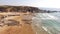 People rest on the beach naer Zambujeira de Mar, Portugal aerial view