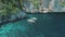 People rest at ocean cliff shore on cruise boat. Travelers, tourists swiming at sea bay water