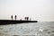People rest on the pier. Silhouette photo.