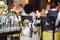 People at the restaurant. Composition of many wineglasses and champagne bottles in bucket on party table