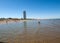 People are resting on a sunny day at the beach in Cesenatico, Italy