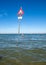 People are resting on a sunny day at the beach in Cesenatico, Italy