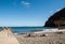 People are resting on a sunny day at the beach in Machico. Madeira Island,