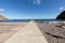 People are resting on a sunny day at the beach in Machico. Madeira Island,