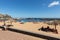 People are resting on a sunny day at the beach in Machico. Madeira Island