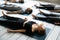 People resting after yoga workout lying in Shavasana Pose