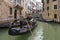 People ride gondolas along the canals of Venice