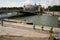 People ride the gyroboards along the Seine embankment under Alexander the Third Bridge in Paris