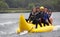 People riding on a banana boat