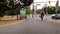 People riding bicycle beside bus station