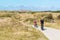 People riding bicycles in dunes of Texel, Netherlands