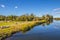 People riding bikes on a trail at the Augusta Canal river