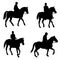 People riding horses silhouettes