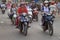 People are riding on motorcycles in Hanoi, Vietnam