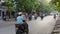 People riding motorcycles in Hanoi Vietnam