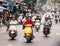 People riding motorcycles on the road at Hanoi, Vietnam