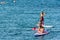 People riding Paddle Surf after COVID 19 La Barceloneta in Barcelona, Spain