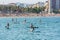 People riding Paddle Surf after COVID 19 La Barceloneta in Barcelona, Spain