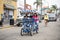 People riding a pedal cart in downtown Pismo Beach