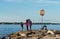 People on a rocky lake shore