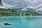 People on a Rowboat on Lake Bled, Slovenia, With Mountains in the Background