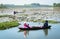 People rowing boat on the lotus lake
