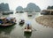 People rowing boats on sea in Halong, Vietnam