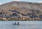 People rowing near the Uros Islands