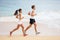 People running - runner couple on beach run