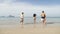 People Running In Water Back Rear View, Girl And Two Couple On Beach Tourists