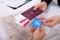 People`s Hand Holding Passport And Boarding Pass With ATM Card