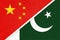 People`s Republic of China or PRC vs Republic of Pakistan national flag from textile. Relationship between two asian countries