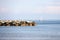 People sail on a sailboat on calm sea