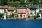 People sailing on a sailboat front of Orta