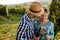 People sampling and tasting wines in vineyard