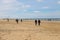People on sandy beach near North sea in Zandvoort